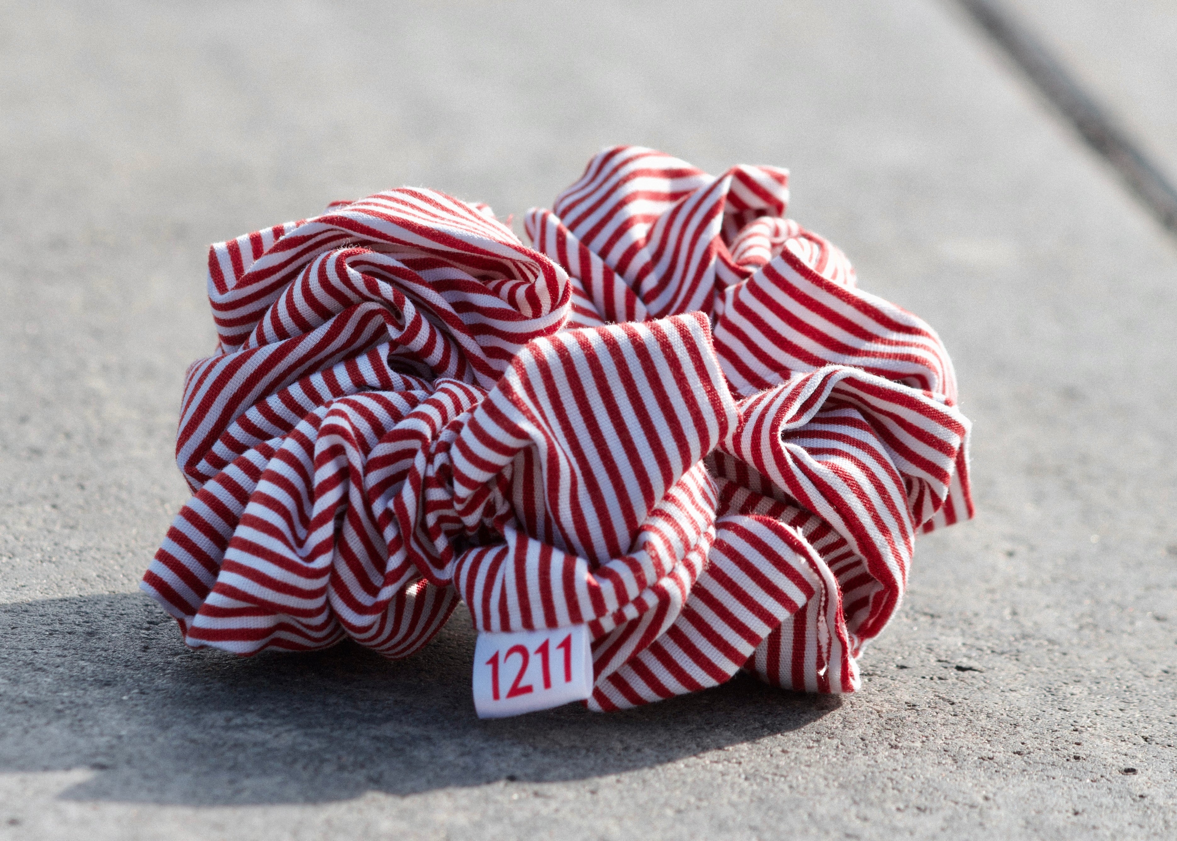 Terracotta scrunchie with white stripes, elegant hair accessory from Twelveeleven, perfect for everyday styling.